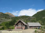Swiftcurrent Mountain and buildings that are part of the Granite Park Chalet