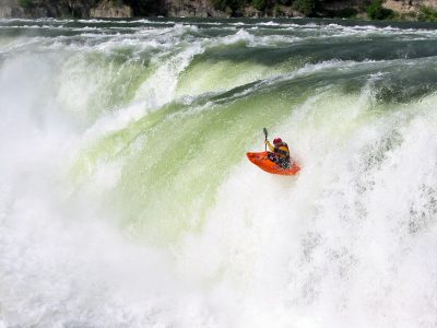 Kayaker Going over Kootenai Falls on the Kootenai River in Montana